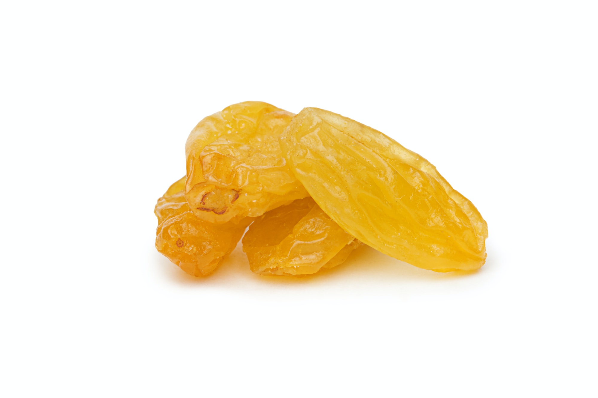 Yellow Raisins isolated on white background.